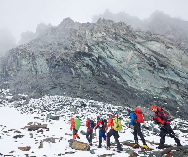 hikers-walking-at-the-bottom-of-grossglockner-moun-2026-03-17-02-26-33-utc